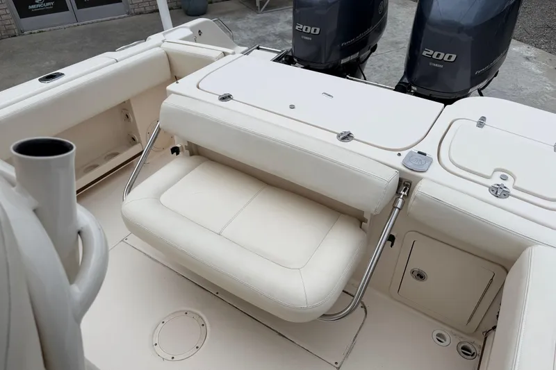 Slide: The Image of 2015 Grady-White Fisherman 257 boat interior with seating and dual Yamaha 200 engines. - 28