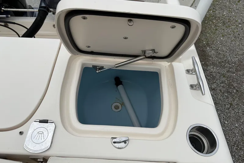 Slide: The Image of Open livewell on 2015 Grady-White Fisherman 257 boat, showing interior and hardware. - 29