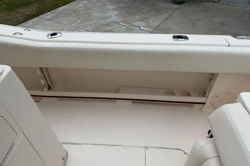 Slide: The Image of 2015 Grady-White Fisherman 257 boat interior with storage compartment and seating. - 33