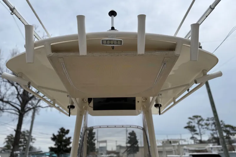 Slide: The Image of 2015 Grady-White Fisherman 257 boat, view of the T-top and rod holders. - 36