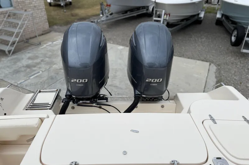Slide: The Image of 2015 Grady-White Fisherman 257 with twin Yamaha 200 engines, docked outdoors. - 37