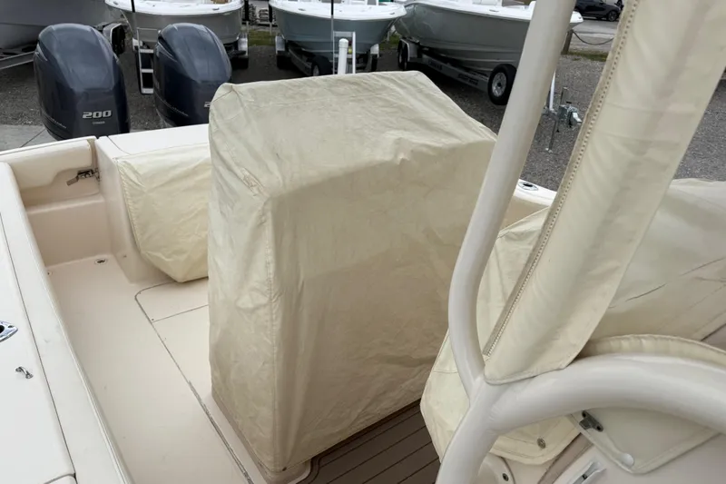 Slide: The Image of 2015 Grady-White Fisherman 257 boat interior with covered seating and dual engines. - 40