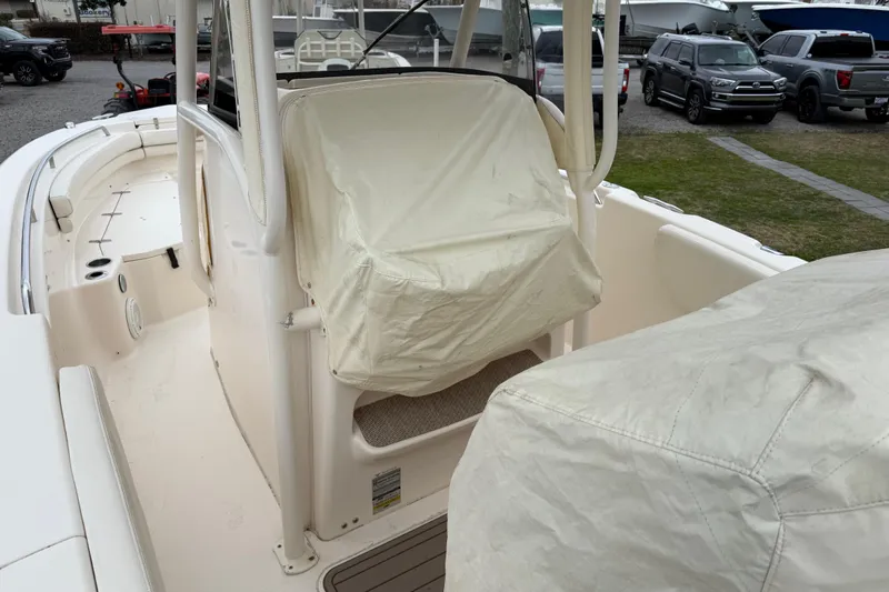Slide: The Image of 2015 Grady-White Fisherman 257 boat interior with covered seats and console. - 42