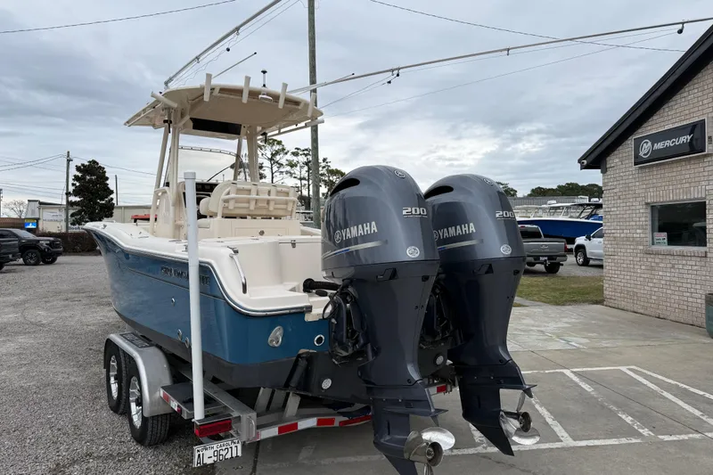 Slide: The Image of 2015 Grady-White Fisherman 257 boat with twin Yamaha engines on a trailer. - 6