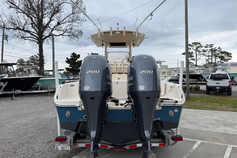 Slide: The Image of 2015 Grady-White Fisherman 257 boat with dual Yamaha 200 engines, parked outdoors. - 7