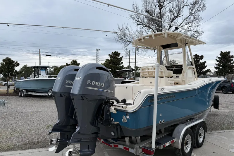 Slide: The Image of 2015 Grady-White Fisherman 257 boat with dual Yamaha engines on a trailer. - 8