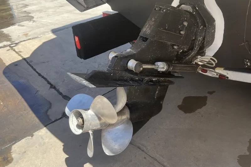 Slide: The Image of 2004 Maxum 2900 SE boat docked at marina, front view with calm water. - 1