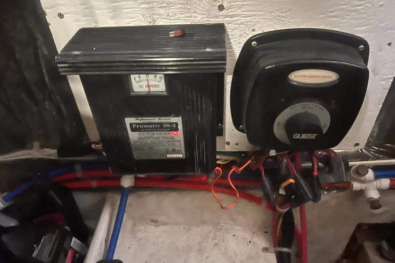 Slide: The Image of Battery master switch and charger in 2004 Maxum 2900 SE boat engine compartment. - 19