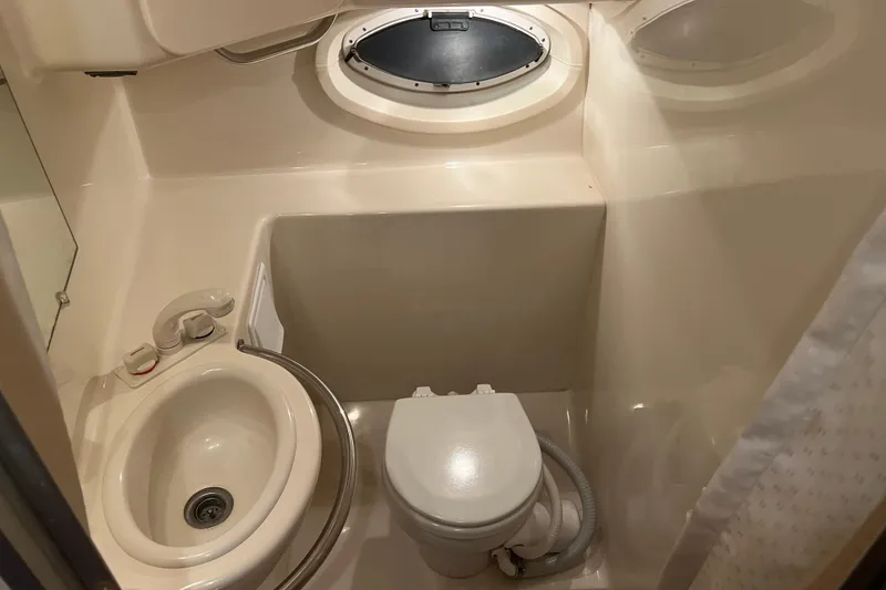 Slide: The Image of Interior cabin of 2004 Maxum 2900 SE boat with cozy sleeping area. - 6