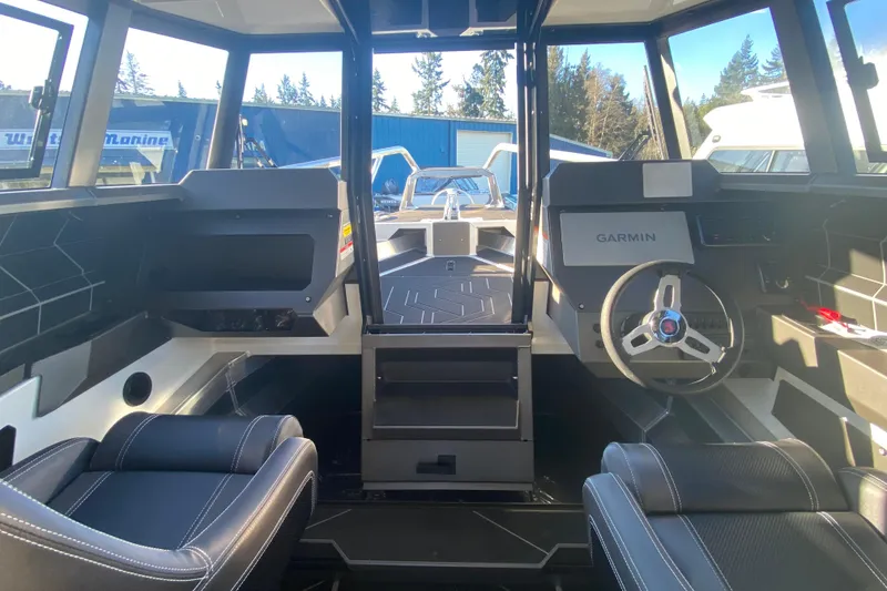 Slide: The Image of Interior of 2026 Stabicraft 2350 ULTRACAB WT SPORTFISH with modern dashboard and seating. - 12