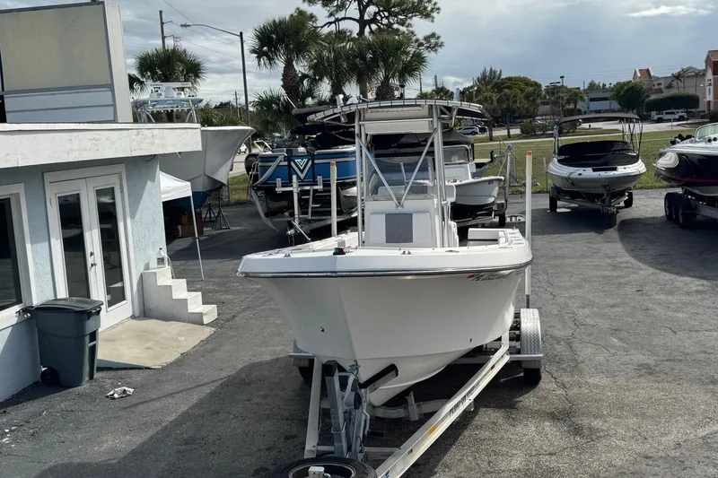 Slide: The Image of 2006 May-Craft 2000CC boat on trailer in outdoor showroom. - 1