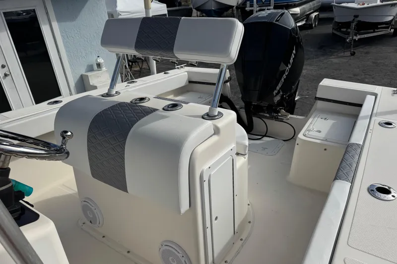 Slide: The Image of 2006 May-Craft 2000CC boat interior with steering console and Mercury outboard motor. - 14