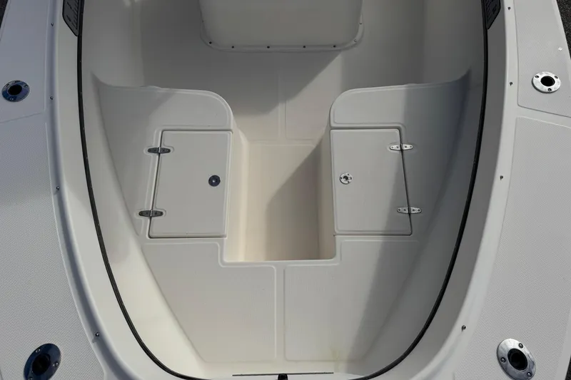 Slide: The Image of 2006 May-Craft 2000CC boat interior with storage compartments. - 17