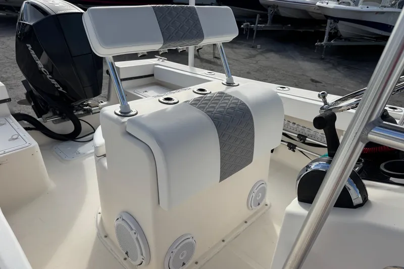 Slide: The Image of 2006 May-Craft 2000CC boat interior with Mercury engine and cushioned seating. - 19