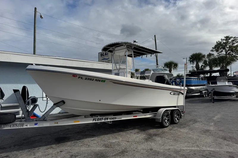 Slide: The Image of 2006 May-Craft 2000CC boat on trailer, parked outdoors under cloudy sky. - 2