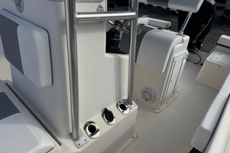 Slide: The Image of 2006 May-Craft 2000CC boat interior with seating and control panel. - 29