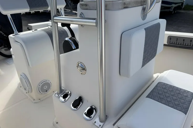 Slide: The Image of 2006 May-Craft 2000CC boat interior with padded seating and control panel. - 30