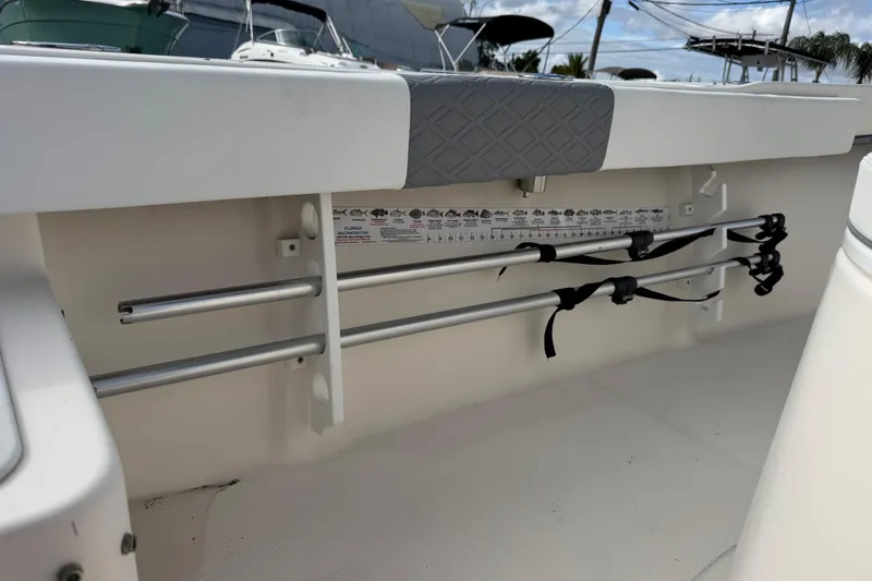 Slide: The Image of 2006 May-Craft 2000CC boat interior with rod holders and fish measurement guide. - 32