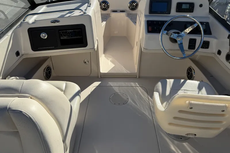 Slide: The Image of 2015 Grady-White Freedom 192 boat interior with steering wheel and seating. - 3