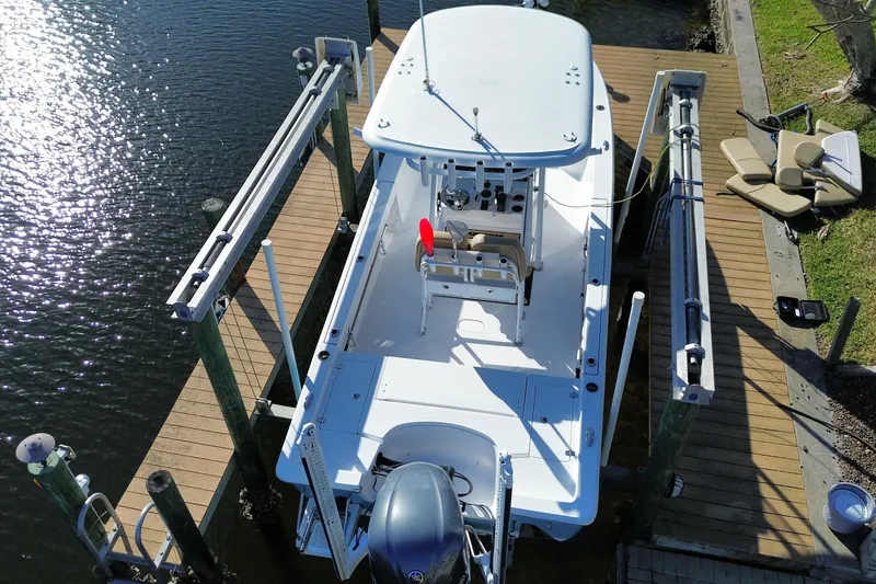 Slide: The Image of 2018 Sportsman Masters 247 Bay Boat docked on a sunny day. - 13