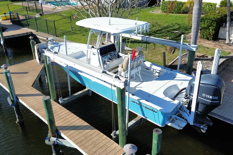 Slide: The Image of 2018 Sportsman Masters 247 Bay Boat docked with Yamaha engine. - 14