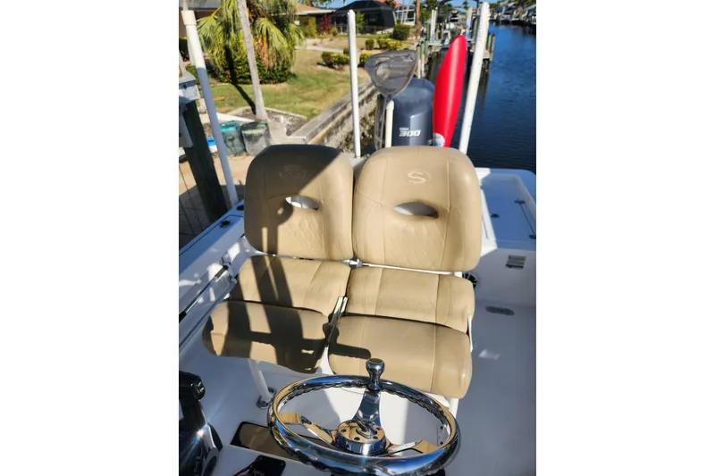 Slide: The Image of 2018 Sportsman Masters 247 Bay Boat with tan seats and steering wheel. - 7