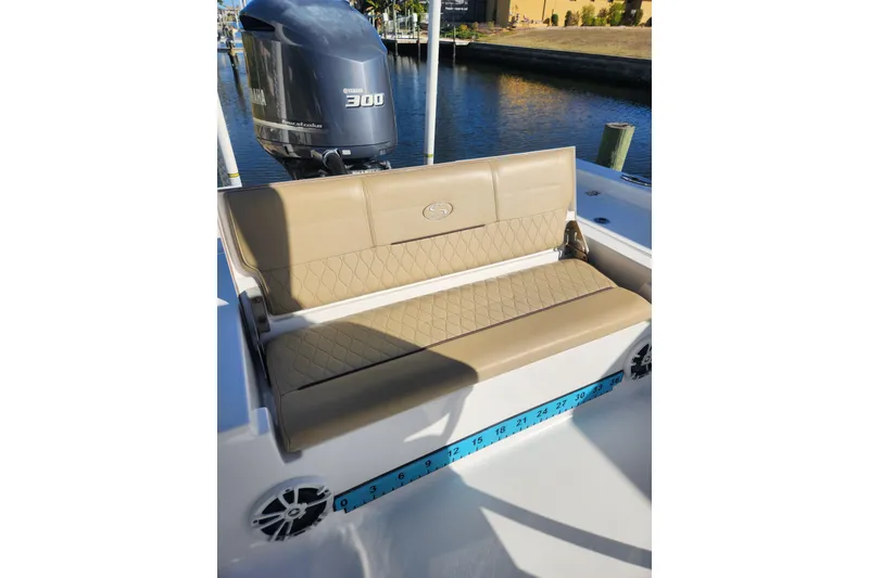 Slide: The Image of 2018 Sportsman Masters 247 Bay Boat with Yamaha 300 engine, featuring tan seating. - 8