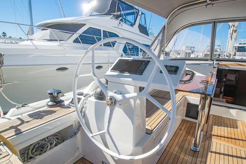 Slide: The Image of Steering wheel of 2021 Bavaria C45 yacht with modern navigation system in marina. - 11