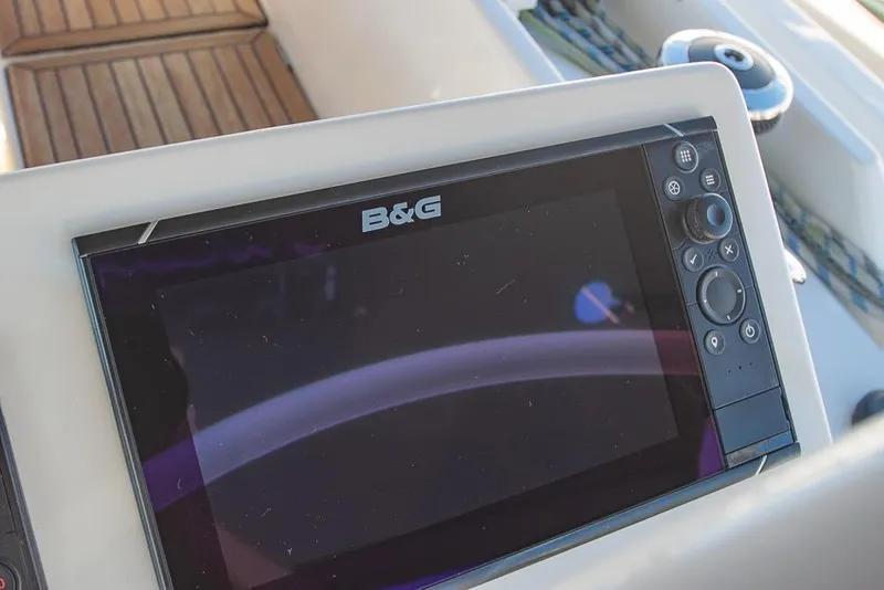 Slide: The Image of B&G navigation system on 2021 Bavaria C45 yacht, featuring a sleek control panel. - 14