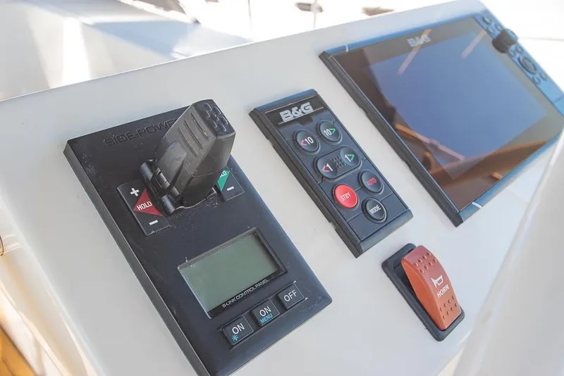 Slide: The Image of Control panel of a 2021 Bavaria C45 yacht with navigation and control systems. - 16