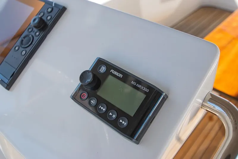 Slide: The Image of Control panel on a 2021 Bavaria C45 yacht, featuring Fusion MS-NRX300. - 18