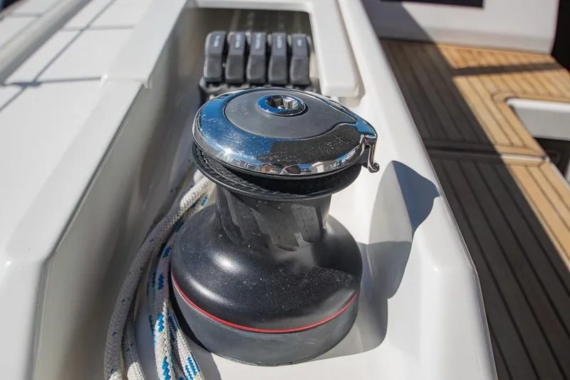 Slide: The Image of Winch on 2021 Bavaria C45 yacht deck with rope and control panel. - 30