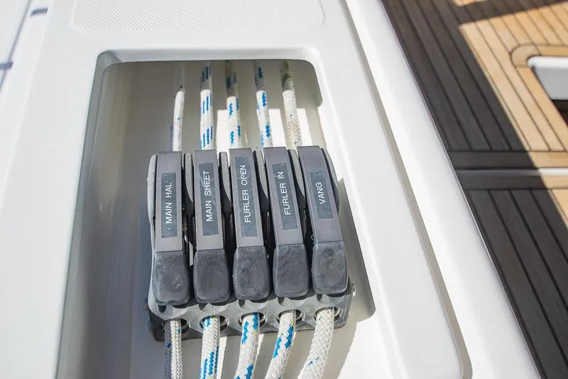 Slide: The Image of Sailing control lines on Bavaria C45 yacht, 2021 model, featuring labeled rope clutches. - 33