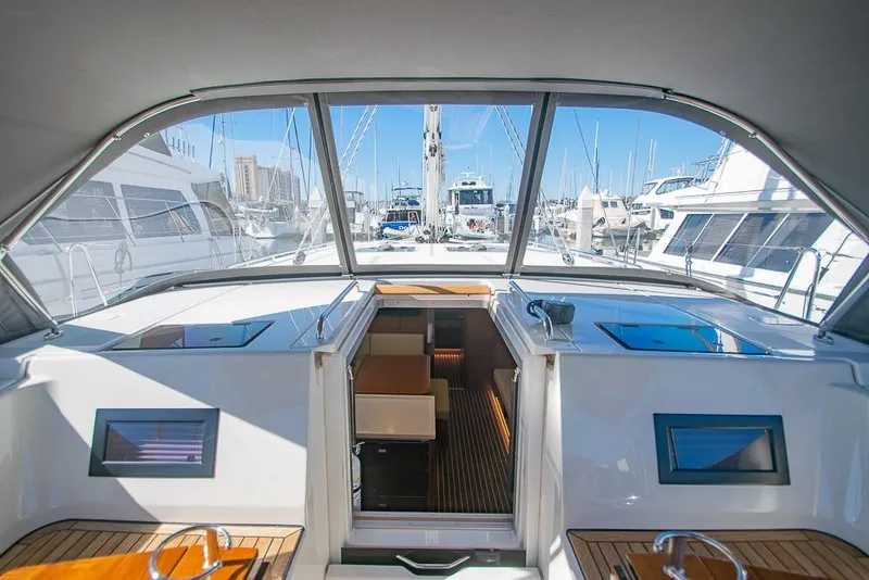 Slide: The Image of Interior view of 2021 Bavaria C45 yacht docked at marina, showcasing sleek design and spacious layout. - 35