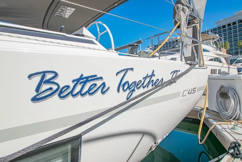 Slide: The Image of Bavaria C45 yacht named "Better Together" docked in marina, 2021 model. - 4