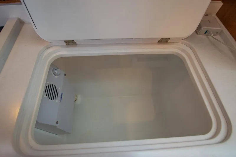 Slide: The Image of Open storage compartment in 2021 Bavaria C45 yacht interior. - 46