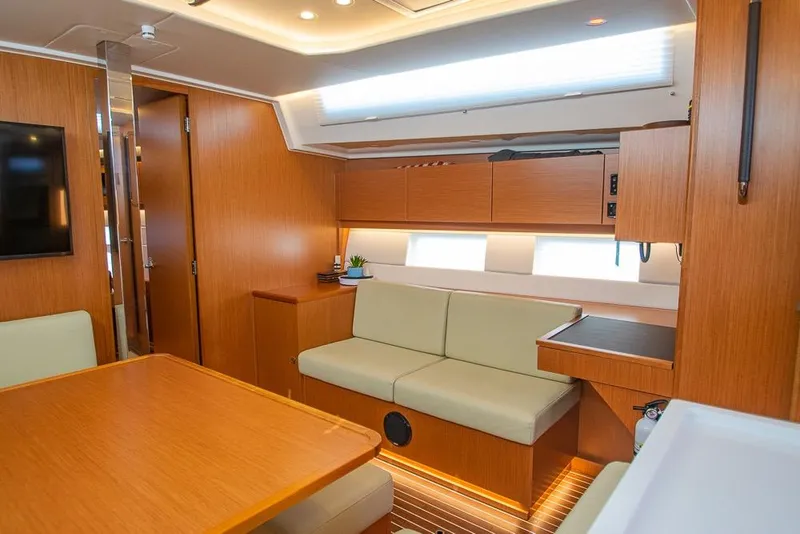 Slide: The Image of Luxurious interior of 2021 Bavaria C45 yacht with modern wood finish and comfortable seating. - 48