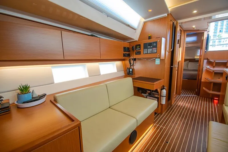 Slide: The Image of Modern interior of 2021 Bavaria C45 yacht with wood finish and cozy seating area. - 51