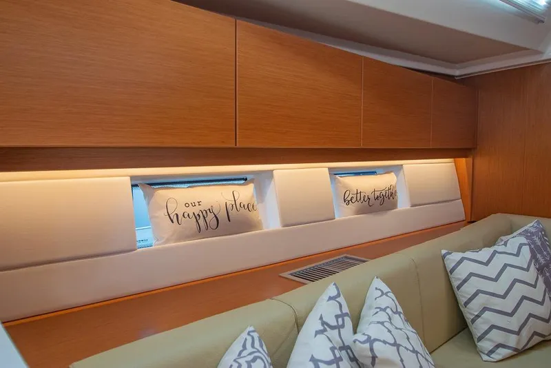 Slide: The Image of Interior of 2021 Bavaria C45 yacht with cozy cushions and wooden cabinetry. - 53