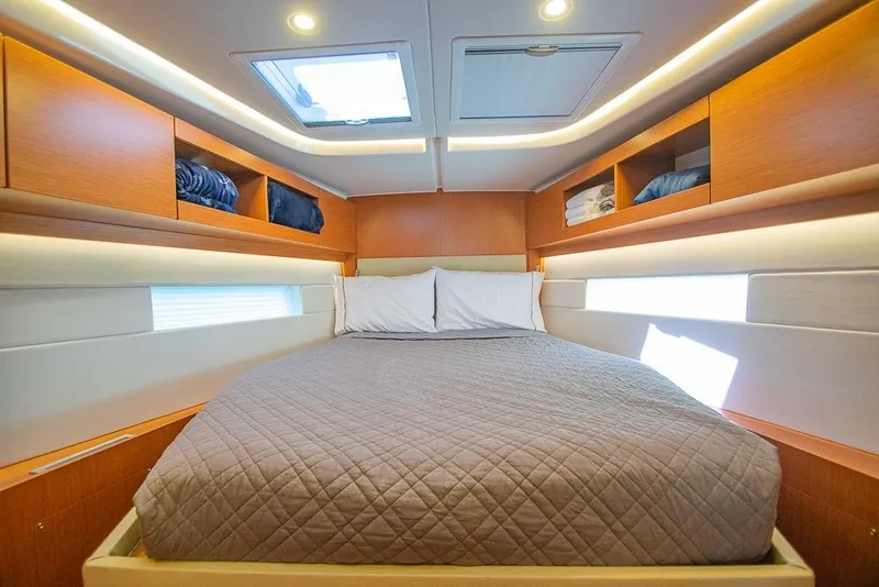 Slide: The Image of Luxurious cabin interior of 2021 Bavaria C45 yacht with cozy bedding and ample storage. - 55