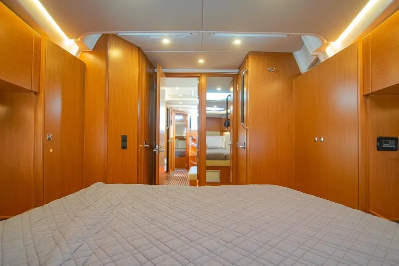 Slide: The Image of Luxurious interior of 2021 Bavaria C45 yacht with wood finish and cozy bedding. - 57