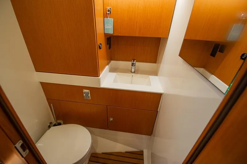 Slide: The Image of Modern bathroom in 2021 Bavaria C45 yacht with wooden cabinetry and sleek fixtures. - 59