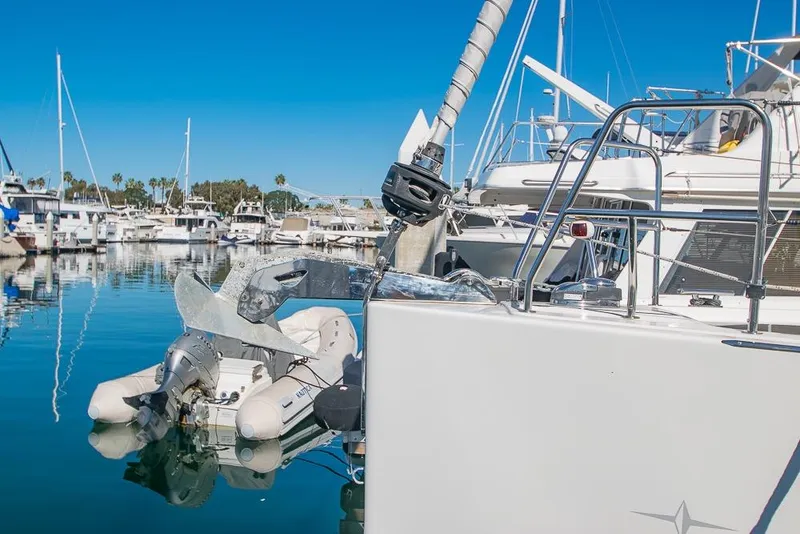 Slide: The Image of Sailboat Bavaria C45 2021 docked in marina with inflatable dinghy attached. - 6