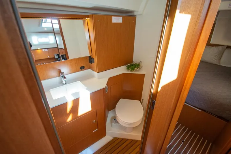 Slide: The Image of 2021 Bavaria C45 yacht bathroom with wooden cabinetry and modern fixtures. - 63