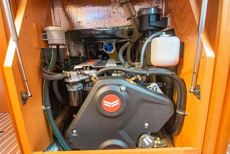 Slide: The Image of Engine compartment of a 2021 Bavaria C45 yacht, showcasing detailed mechanical components. - 66