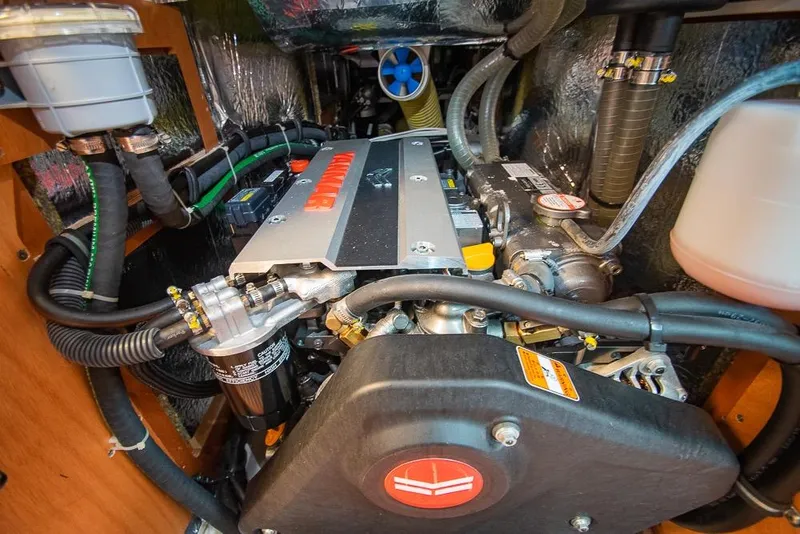 Slide: The Image of Engine compartment of a 2021 Bavaria C45 yacht, showcasing detailed mechanical components. - 67