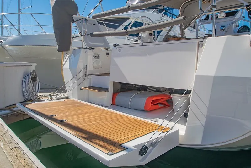 Slide: The Image of Stern view of 2021 Bavaria C45 yacht with open swim platform at marina. - 71