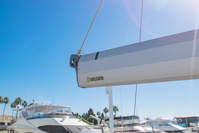 Slide: The Image of Sailboat Bavaria C45 (2021) with Selden boom, docked under clear blue sky. - 75