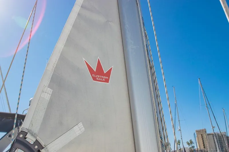 Slide: The Image of Sail of 2021 Bavaria C45 yacht with Elvstrøm Sails logo under clear blue sky. - 79