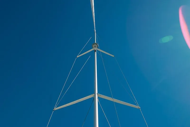 Slide: The Image of Sailboat mast of 2021 Bavaria C45 against clear blue sky. - 85
